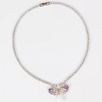 Elegant Svanhalsband och Örhängen med Rosa/Lila Stenar