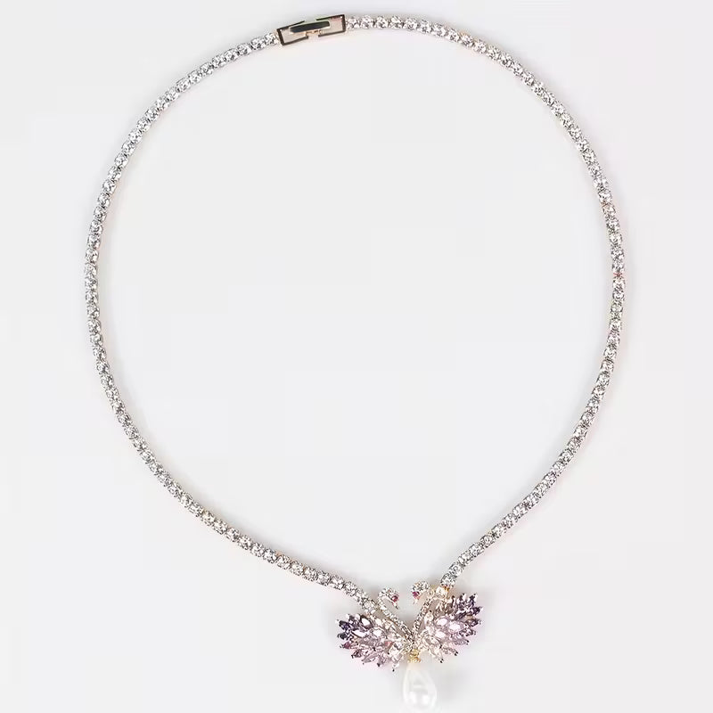 Elegant Svanhalsband och Örhängen med Rosa/Lila Stenar