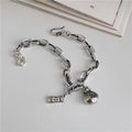 Lucky Bag & Dollar Charm Bracelet – Silvery Plated | Elegant Good Fortune Jewelry